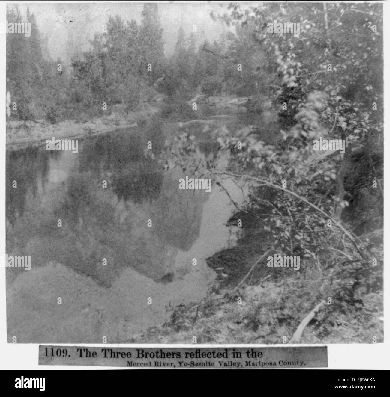 The Three Brothers reflected in the Merced River, Yosemite Valley, Mariposa County Stock Photo