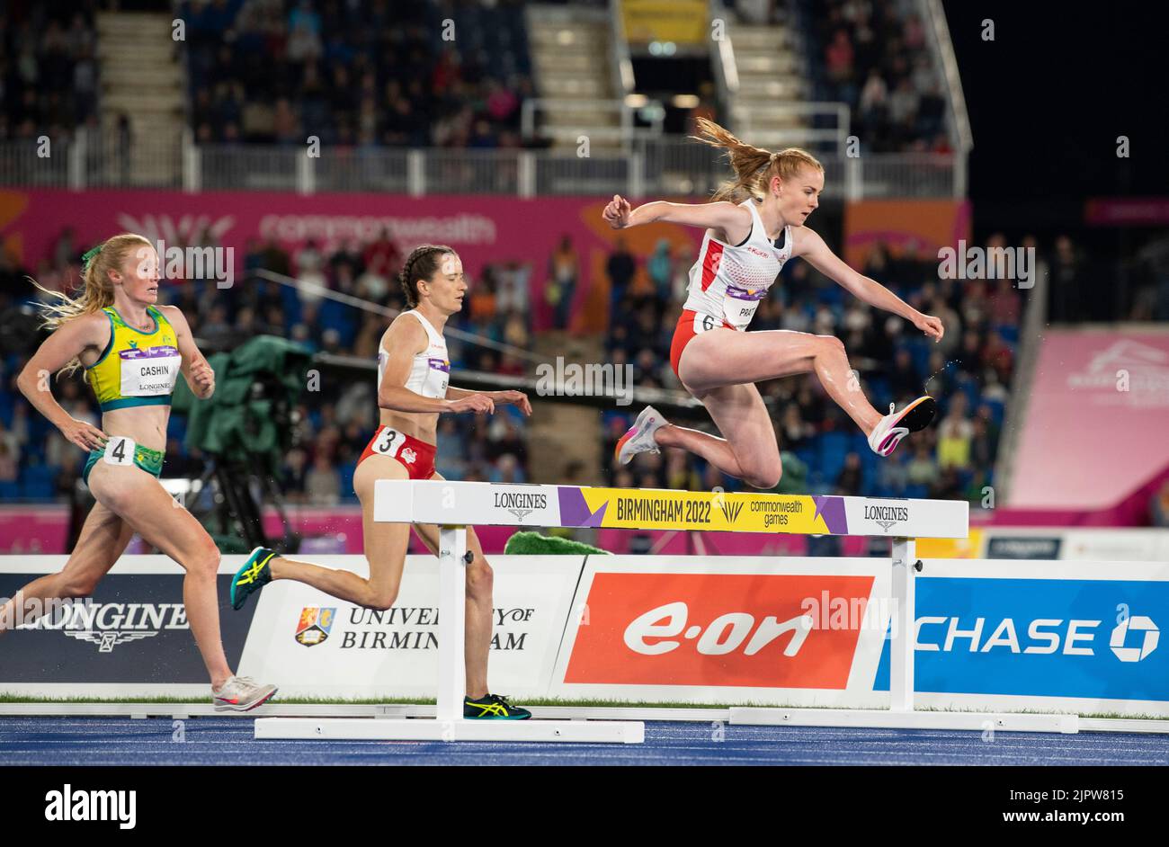 Amy Cashin of Australia and Lizzie Bird and Aimee Pratt of England competing in the women’s 3000m steeplechase final at the Commonwealth Games at Alex Stock Photo