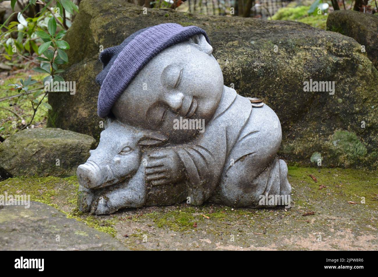 Jizo Bosatsu, statue of buddhist monk with a pig. Daishoin Temple