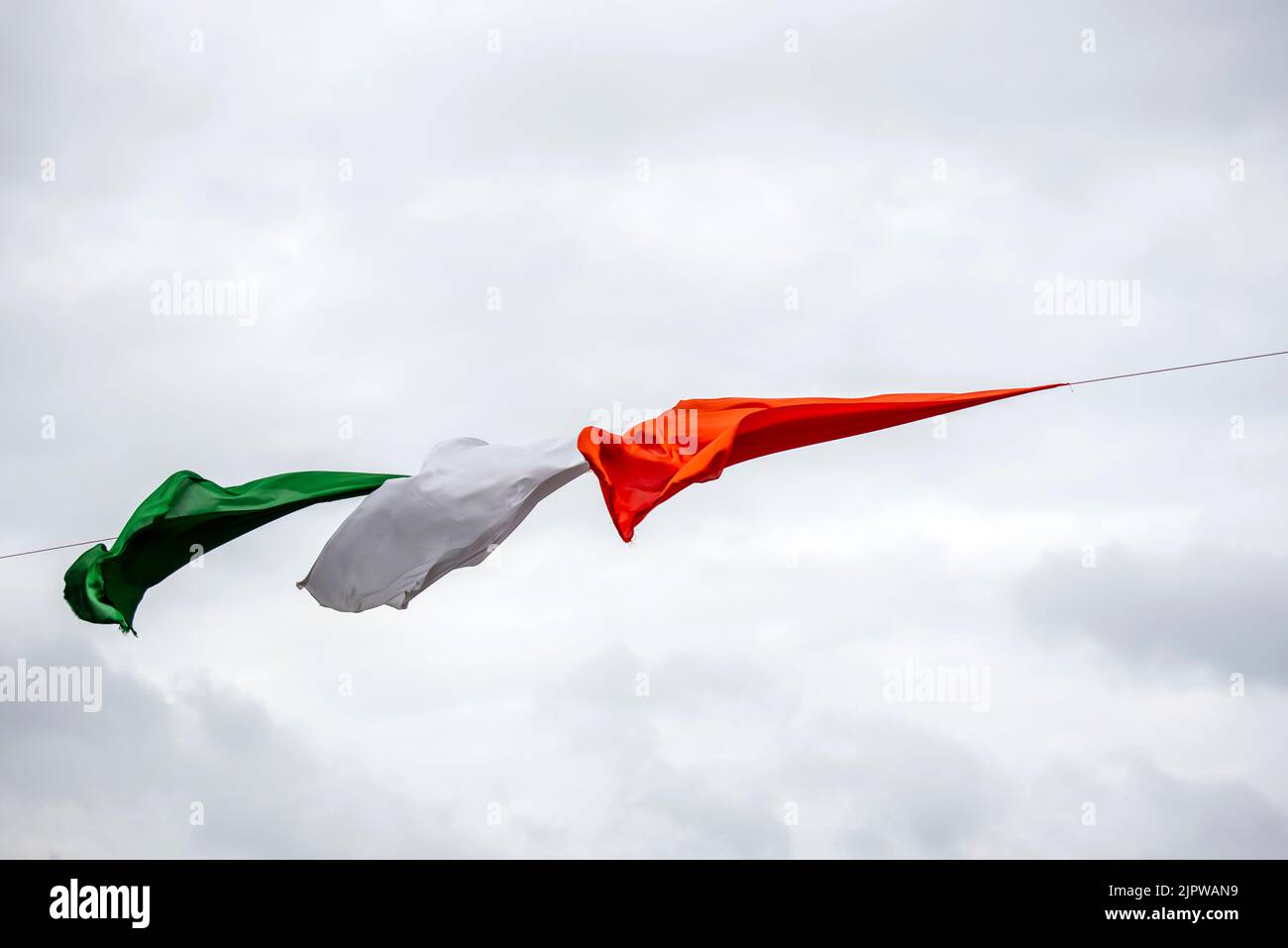 Indian Tricolor cloth are flying in blue sky Stock Photo