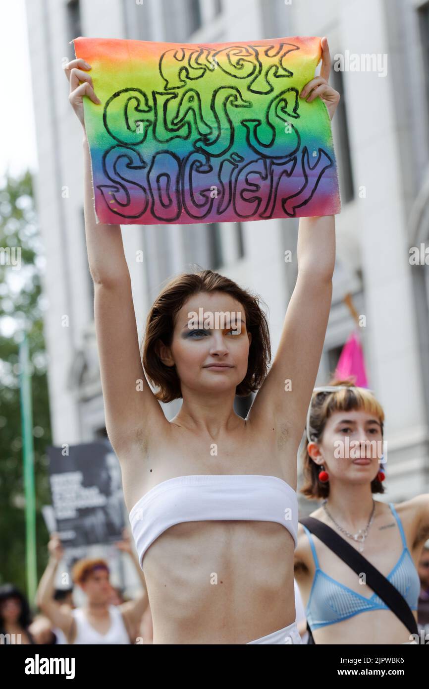 A young woman holding a High Class Society sign participate in the Montreal Pride Parade,Quebec,Canada Stock Photo