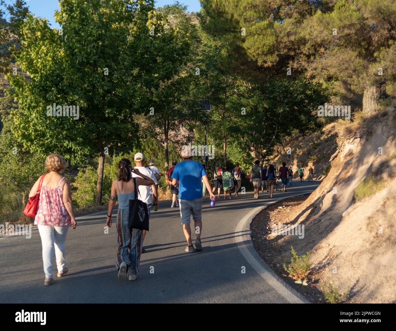 Viznar, Granada, Spain, August 18, 2022: Group of people walking along the road from Viznar to Alfacar on the occasion of the popular march in tribute Stock Photo
