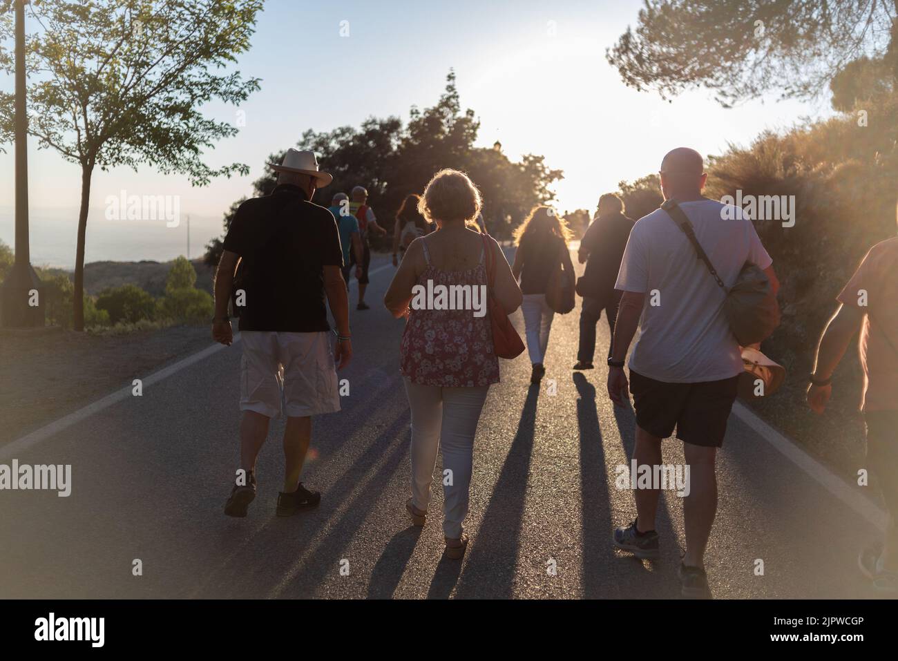 Viznar, Granada, Spain, August 18, 2022: Group of people walking along the road from Viznar to Alfacar on the occasion of the popular march in tribute Stock Photo
