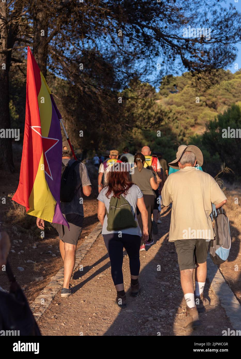 Viznar, Granada, Spain, August 18, 2022: Group of people walking along a path in the Viznar ravine on the occasion of the popular march in tribute to Stock Photo