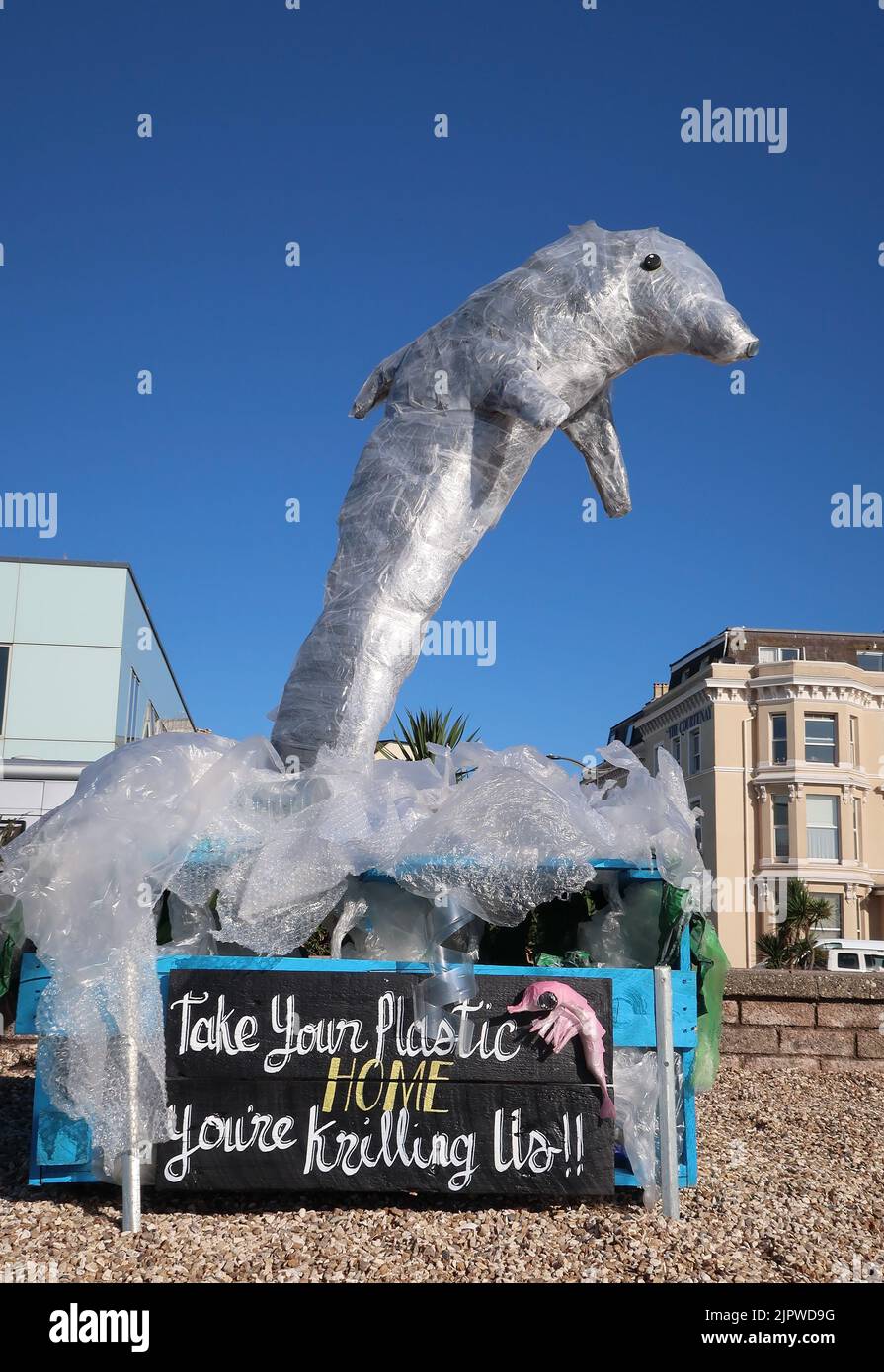 Recycled art in the form of a bottlenose dolphin on the seafront at Teignmouth, using recycled materials to raise awareness of environmental issues. Stock Photo