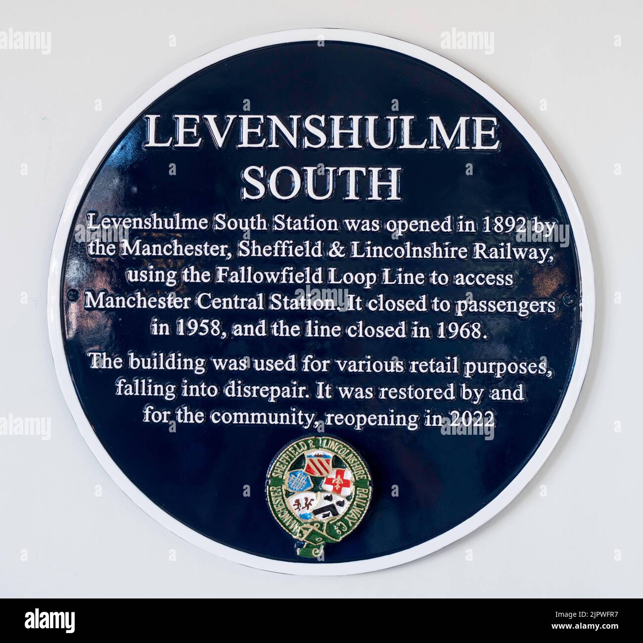 A plaque within the restored Levenshulme South station, now a cycle café and bar in Manchester, England, UK Stock Photo
