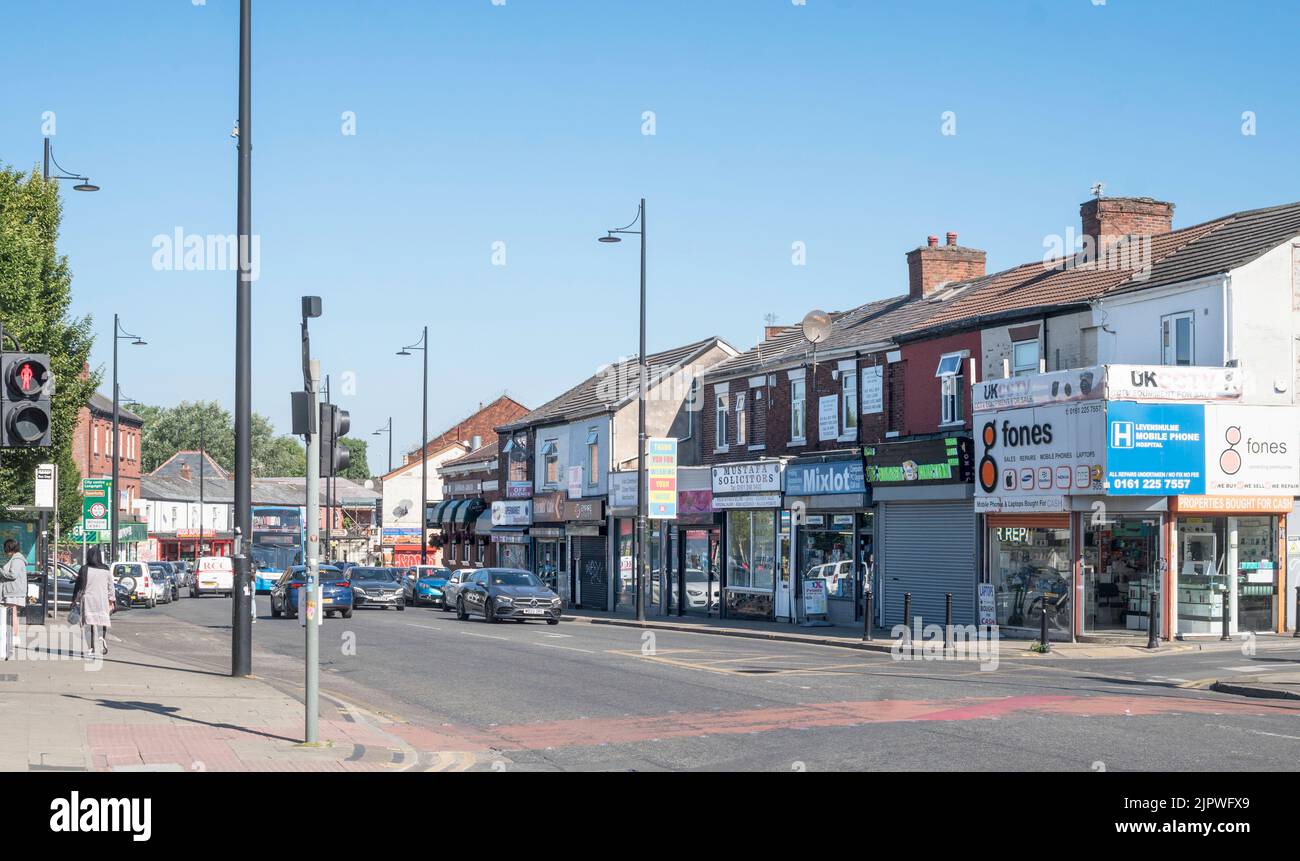 Shops in Stockport Road in Levenshulme, Manchester, England, UK Stock Photo