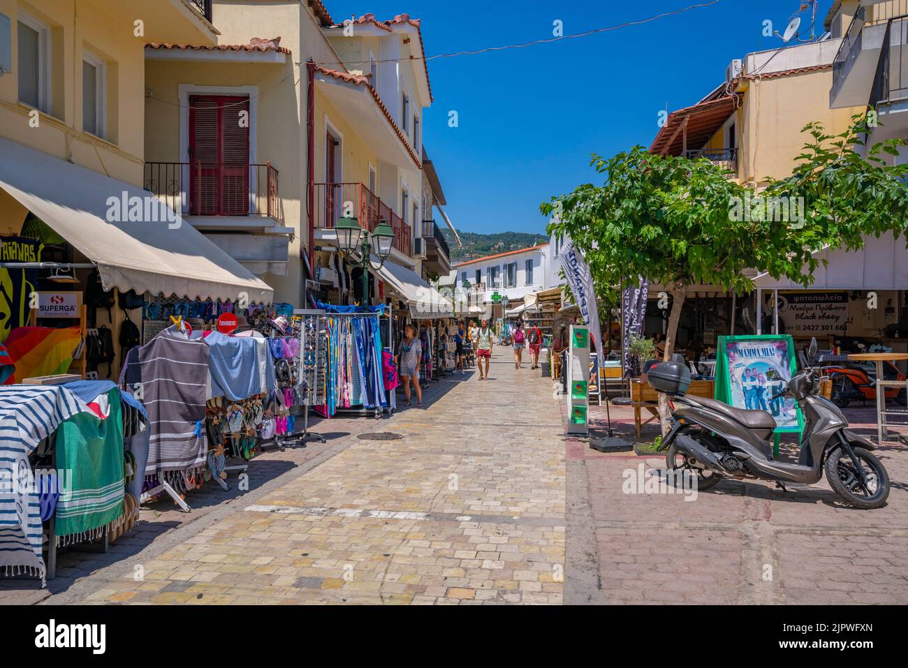 View Of Shops In Main Street In Skiathos Town Skiathos Island view-of-shops-in-main-street-in-skiathos-town-skiathos-island