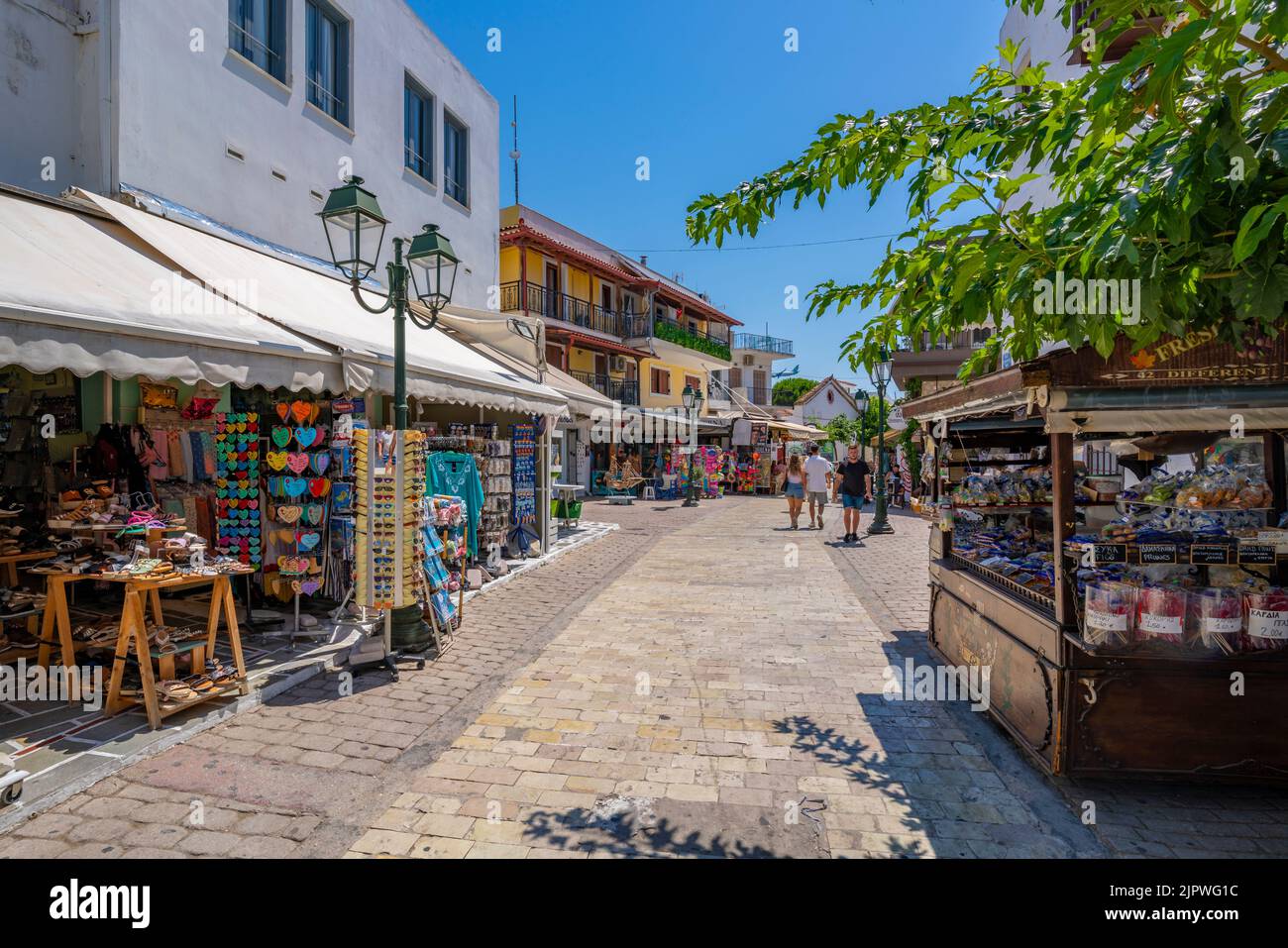 View of shops and cafes in main street in Skiathos Town, Skiathos Island, Sporades Islands, Greek Islands, Greece, Europe Stock Photo