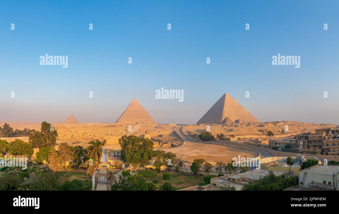 Giza, Egypt; August 16, 2022 - Sunrise at The Pyramids Of Giza, Egypt. Stock Photo