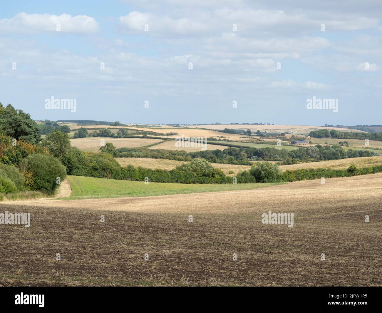 2022 drought from the Lincolnshire Wolds village of Market Stainton looking east towards Scamblesby. Dry brown fields. Stock Photo