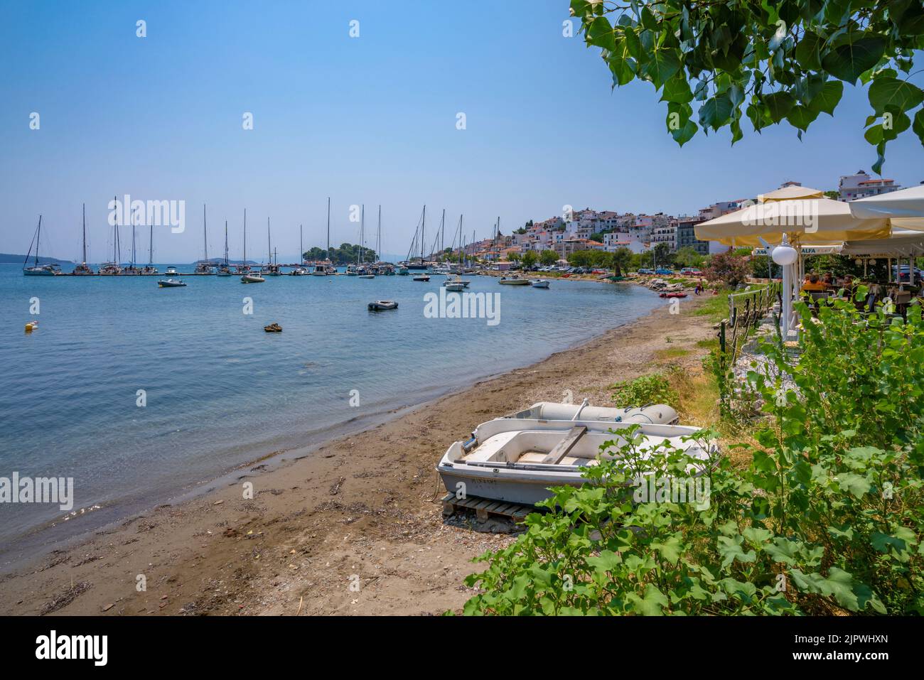 View of boats and restaurants in Skiathos Town, Skiathos Island, Sporades Islands, Greek Islands, Greece, Europe Stock Photo