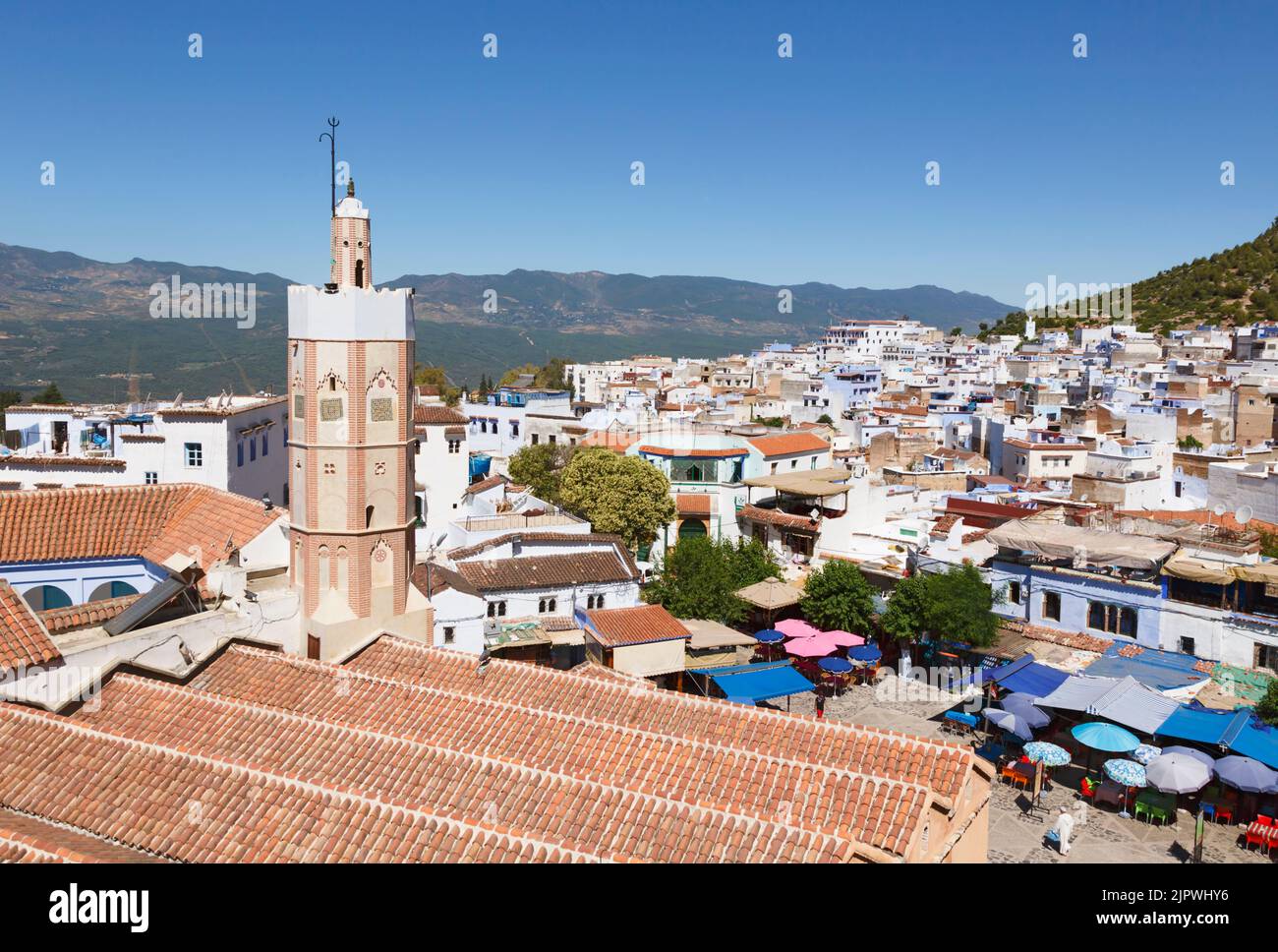 Chefchaouen, Morocco.  View to medina across Place Outa El Hamman. Minaret of the Great Mosque. Stock Photo