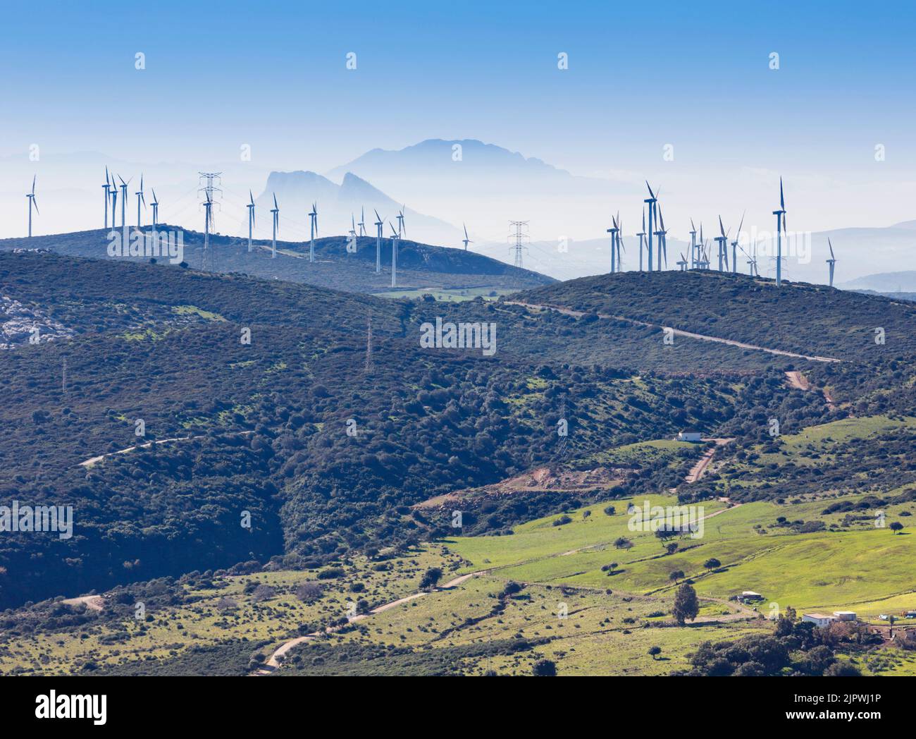The Pillars of Hercules.  Windmills, Gibraltar and Morocco in Africa seen from Casares, Malaga Province, Andalusia, southern Spain. Gibraltar is behin Stock Photo