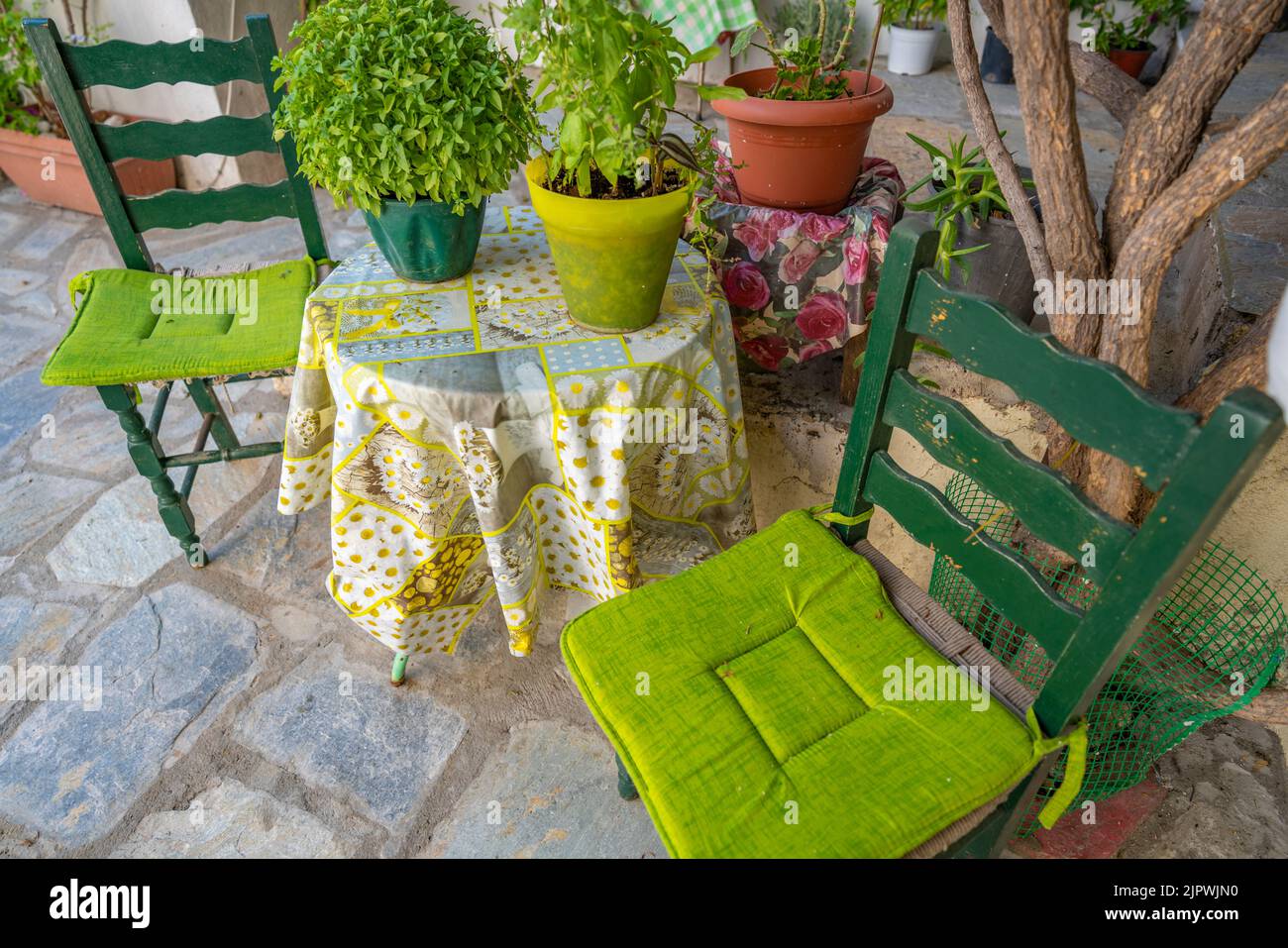 View of colourful table and chairs, Skiathos Town, Skiathos Island, Sporades Islands, Greek Islands, Greece, Europe Stock Photo