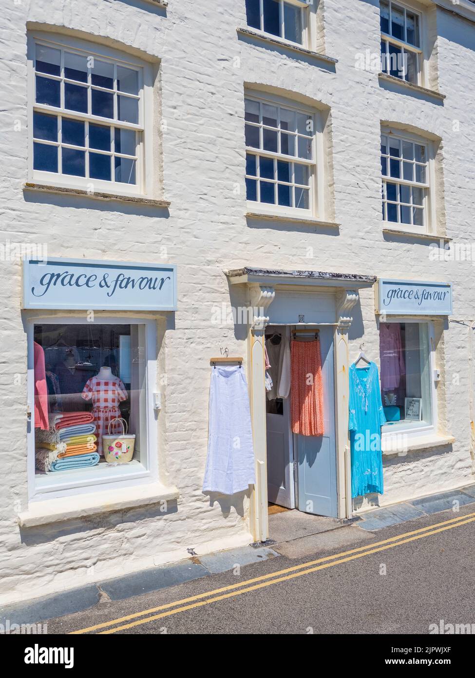 Local Clothing Shop, St Mawes, Falmouth, Cornwall, England, UK. Stock Photo