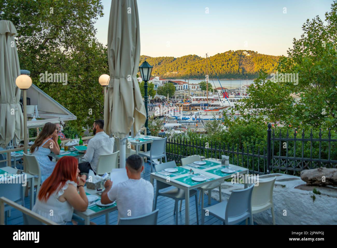 View of restaurant overlooking Old Port in Skiathos Town, Skiathos Island, Sporades Islands, Greek Islands, Greece, Europe Stock Photo