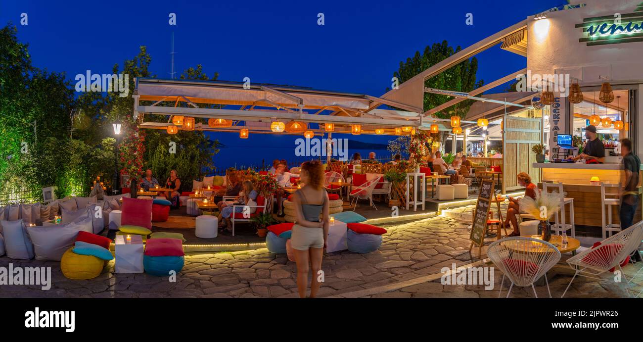 View of restaurant and bars in Skiathos Town at dusk, Skiathos Island, Sporades Islands, Greek Islands, Greece, Europe Stock Photo
