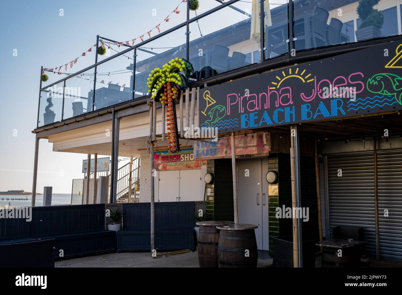 Lowestoft, Suffolk, UK – August 14 2022. The exterior of Piranha Joes Beach Bar on the promenade in the seaside town of Lowestoft on the Suffolk Co Stock Photo