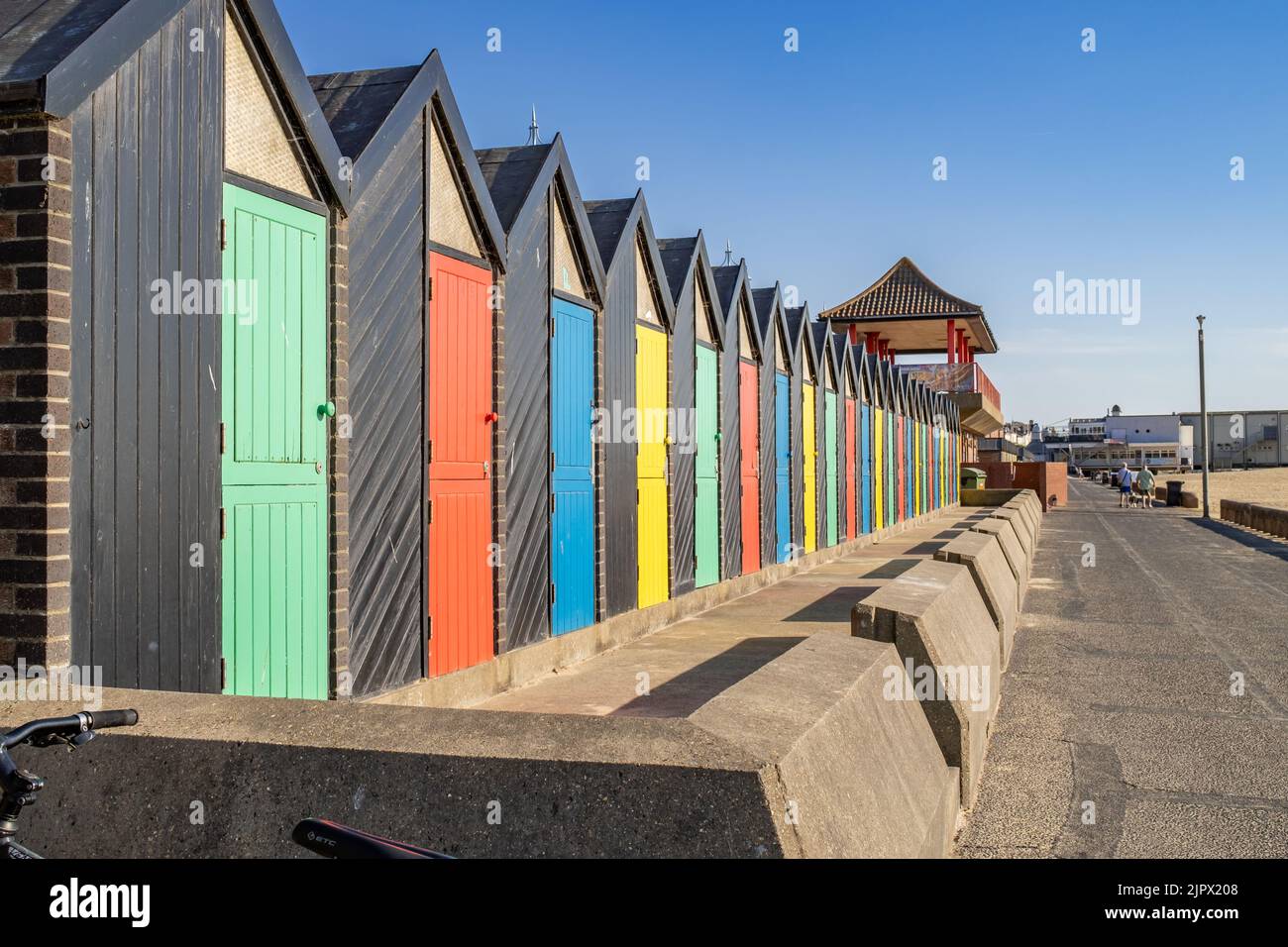 Colourful beach huts on Lowestoft promenade. Captured on a bright and