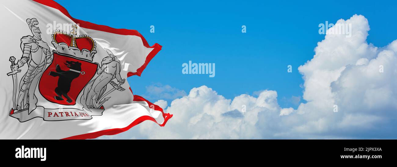 official flag of zemaitija lithuania at cloudy sky background on sunset, panoramic view. lithuanian travel and patriot concept. copy space for wide ba Stock Photo