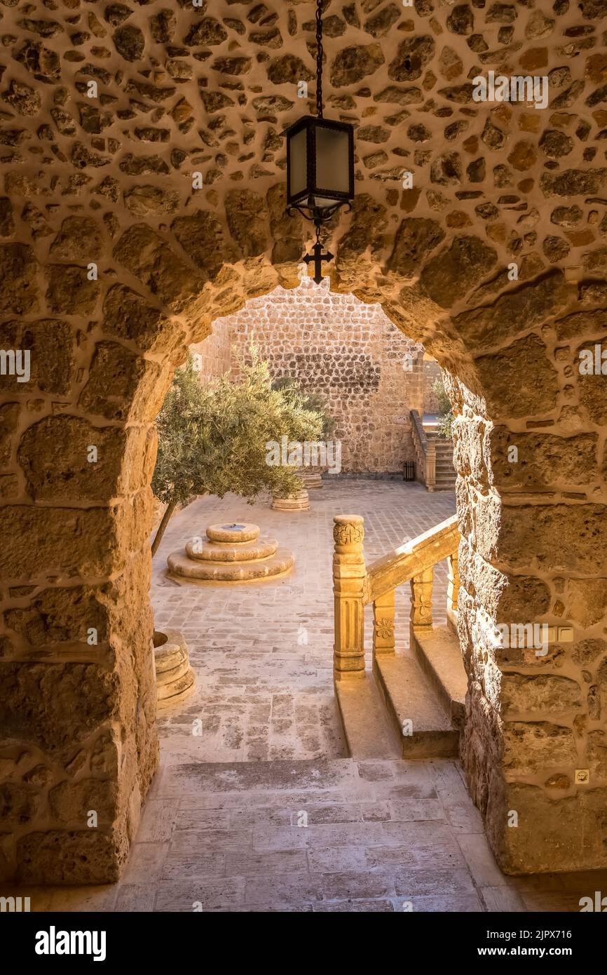 Arched way to inner yard of the Mor Hananyo Monastery in Mardin, Turkey Stock Photo