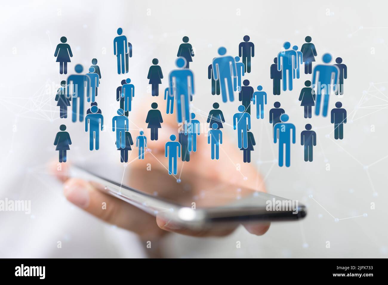 A 3D rendering of people icons floating above a phone in a person's ...