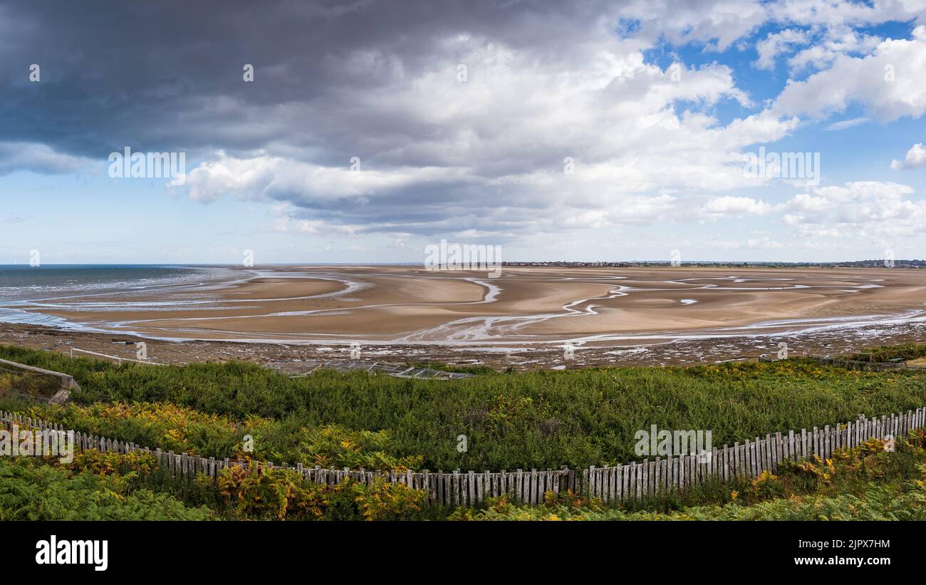 A multi image panorama of the channels of water draining off the beach at Holylake, seen from Hilbre Island in the Dee Estuary. Stock Photo
