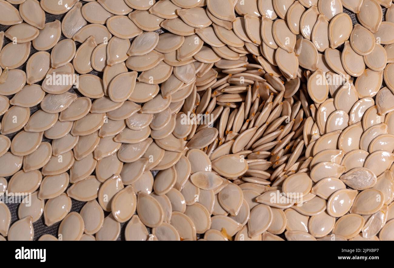 Pumpkin seeds creating a natural, spiral structure. Pure pumpkin seeds Stock Photo Alamy
