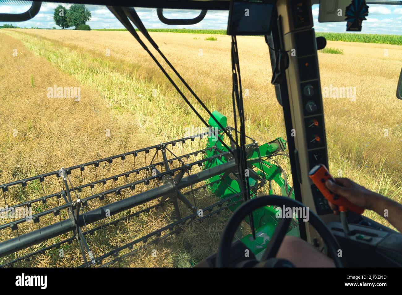 combine harvester harvesting the crop. High quality photo Stock Photo - Alamy