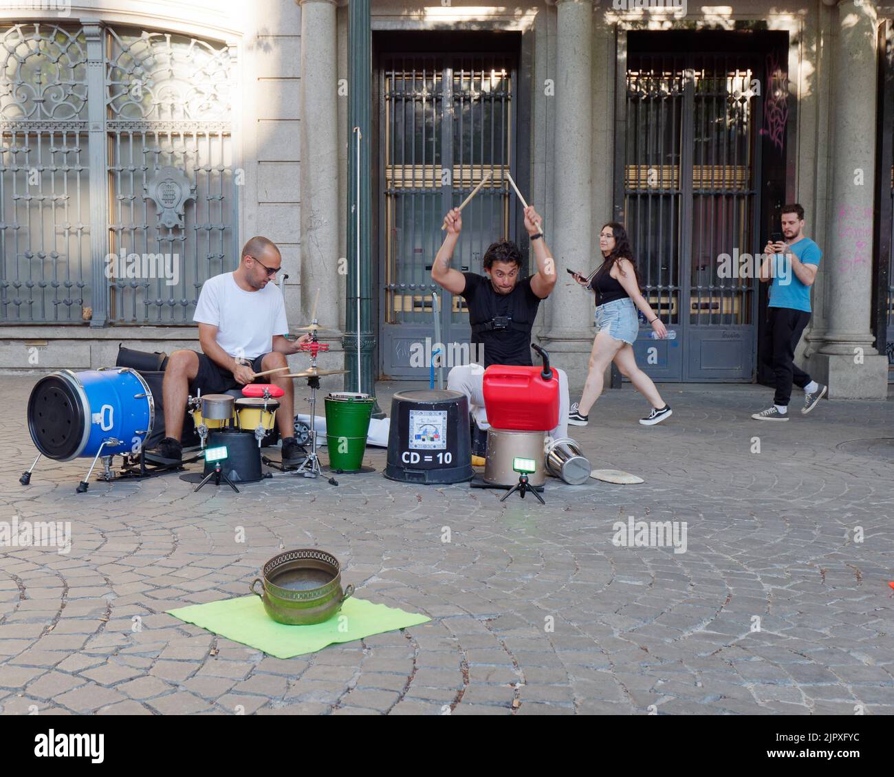 Drummers using traditional and makeshift instruments busking in the Avenida dos Aliados (Avenue of the Allies) Porto, Portugal. Stock Photo