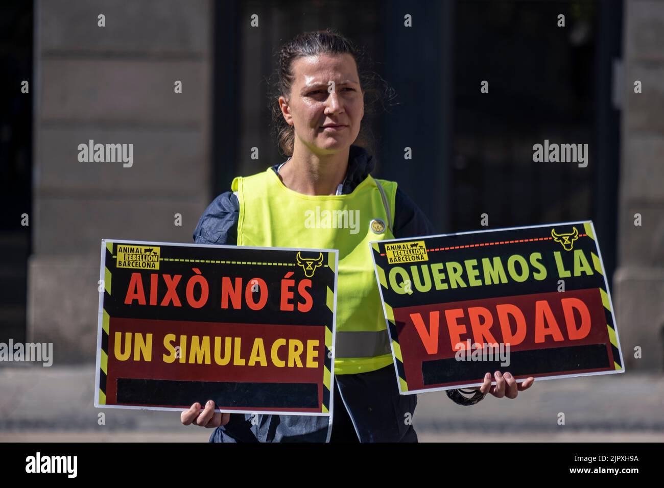 Barcelona, Spain. 20th Aug, 2022. A climate justice activist is seen holding placards during the demonstration. Climate activists have gathered in Plaza de Sant de Sant Jaume in front of the door of the headquarters of the presidency of the Government of Catalonia, to demand climate justice. Credit: SOPA Images Limited/Alamy Live News Stock Photo