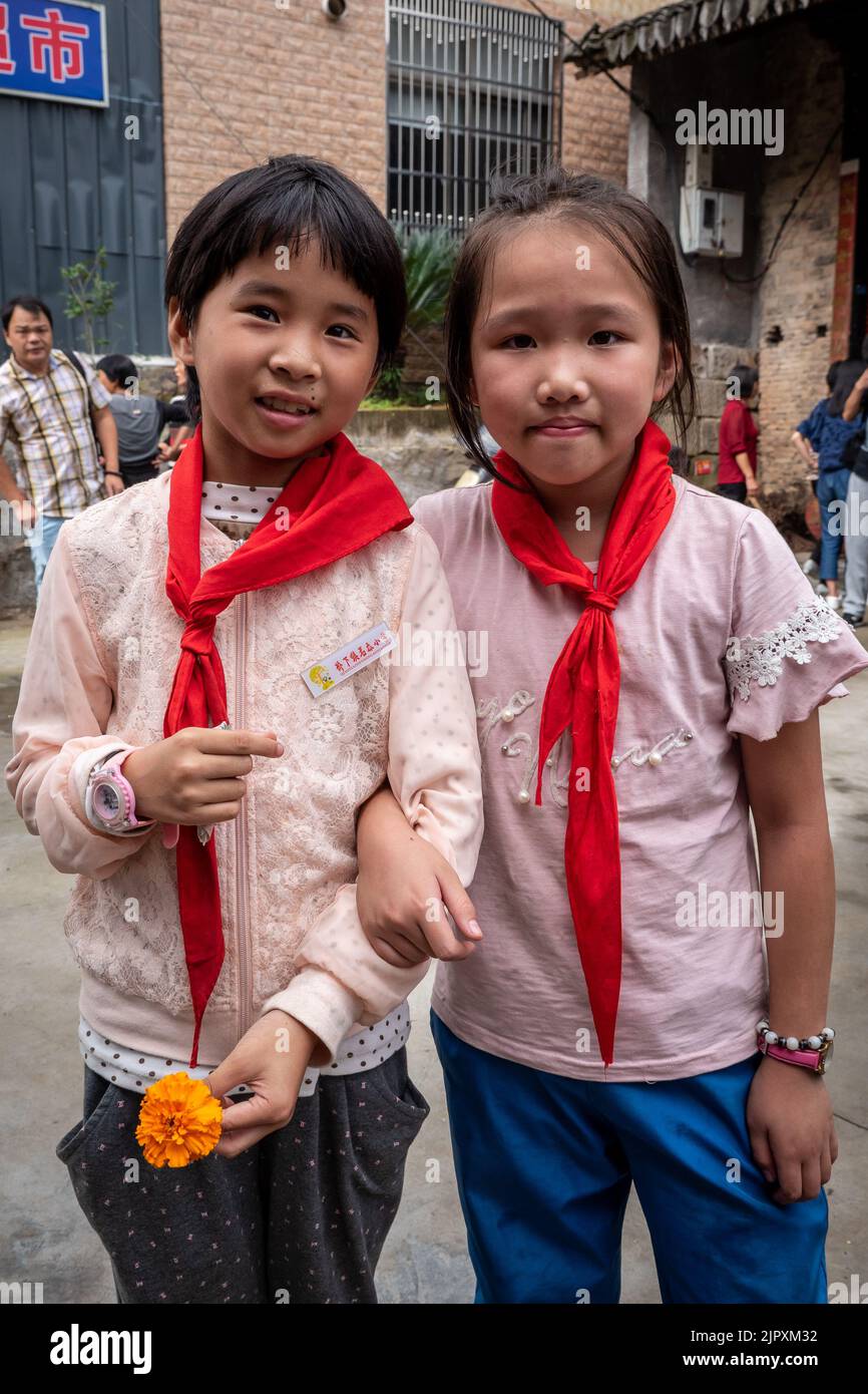 Chinese School Children wear uniform of red neck scarf Stock Photo