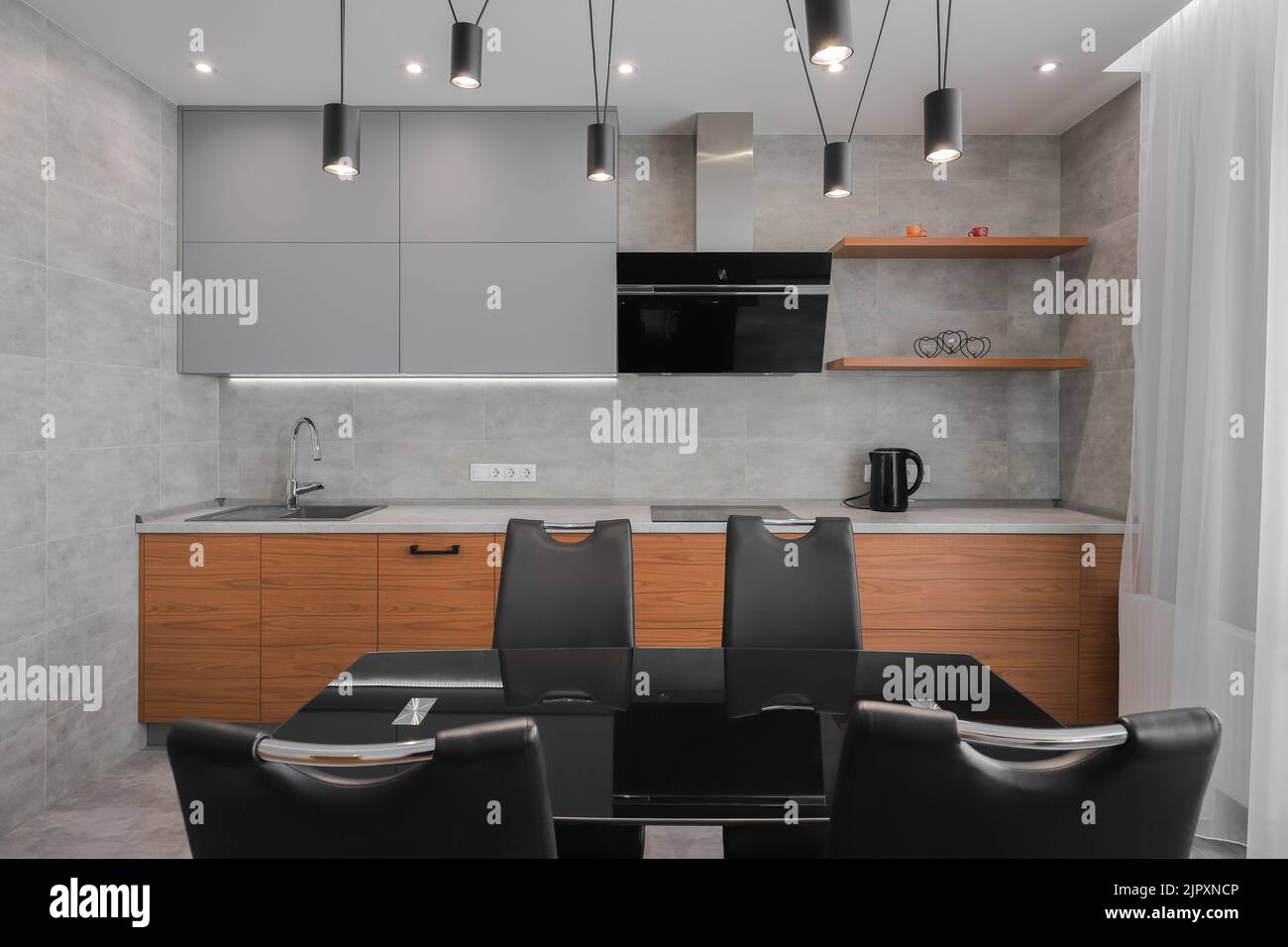 Dining table in a modern kitchen interior Stock Photo - Alamy