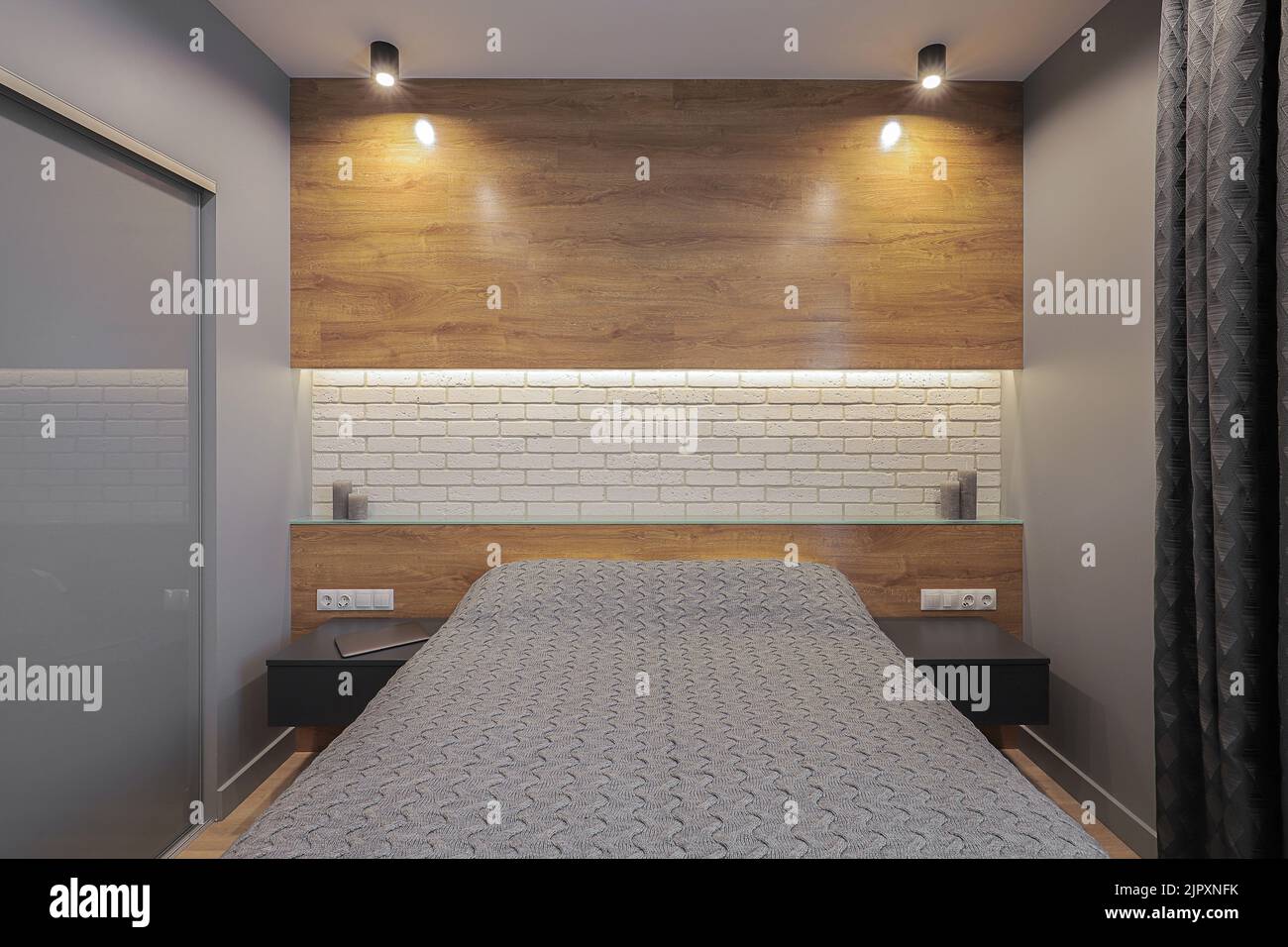 Double bed in a modern bedroom interior in gray tones Stock Photo - Alamy