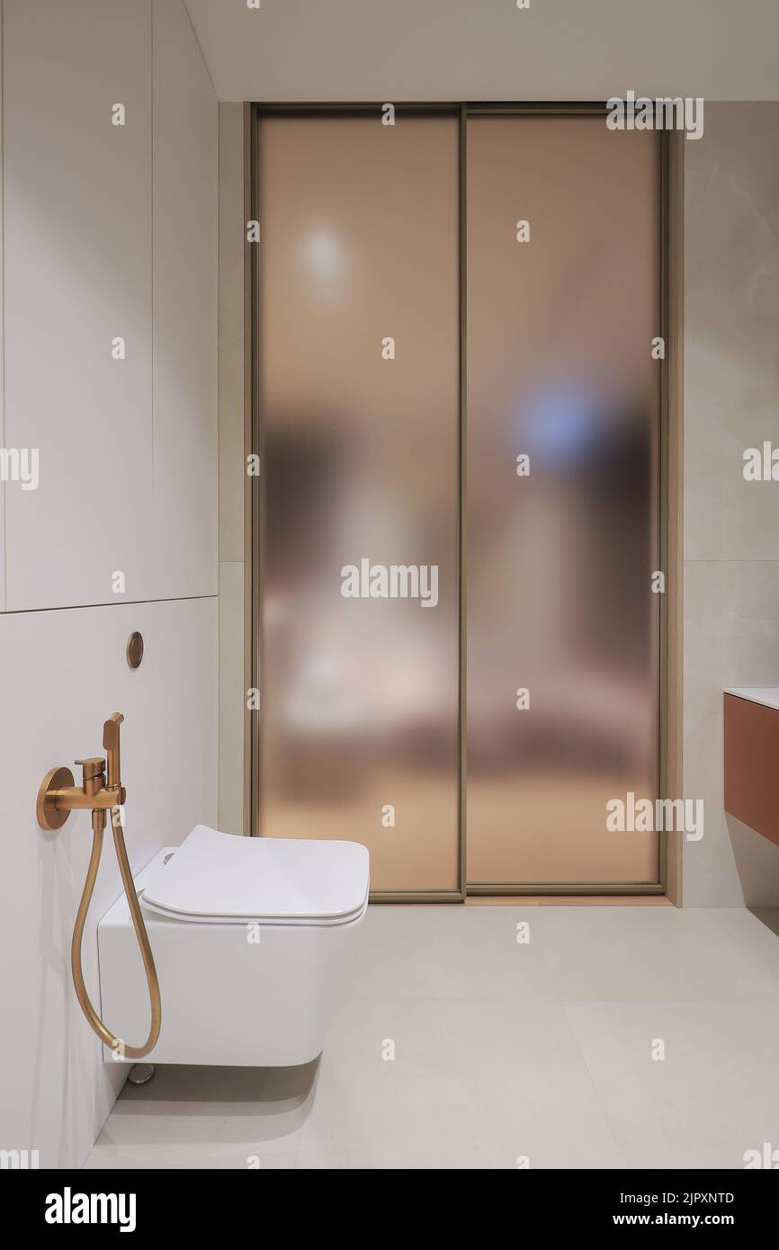 White toilet bowl in a modern bathroom interior Stock Photo - Alamy