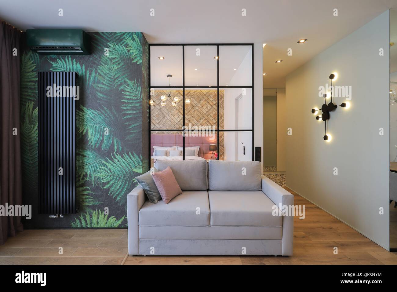 Gray sofa in a modern apartment interior design Stock Photo - Alamy
