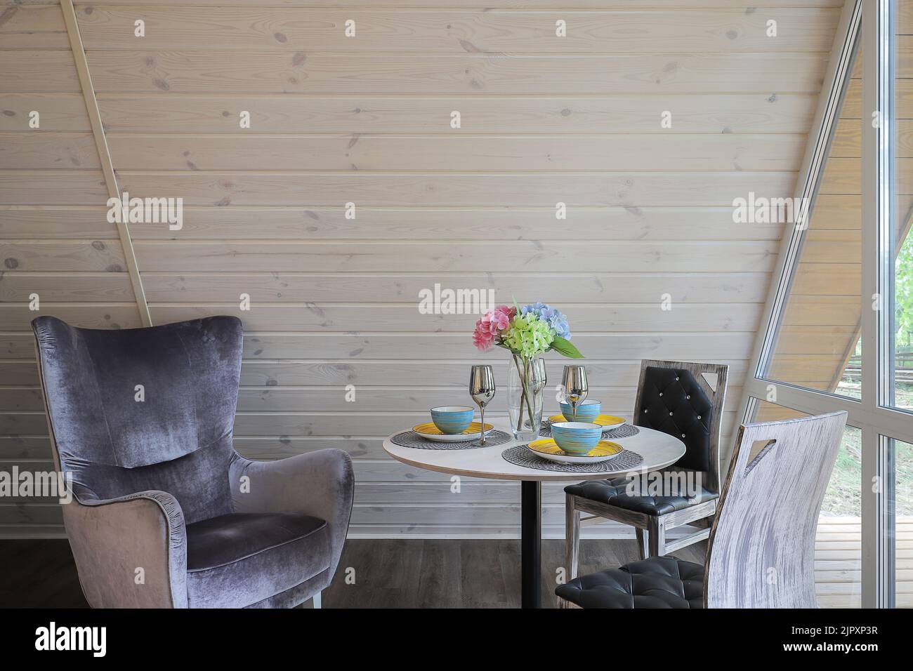 Round dining table in a modern interior design Stock Photo - Alamy