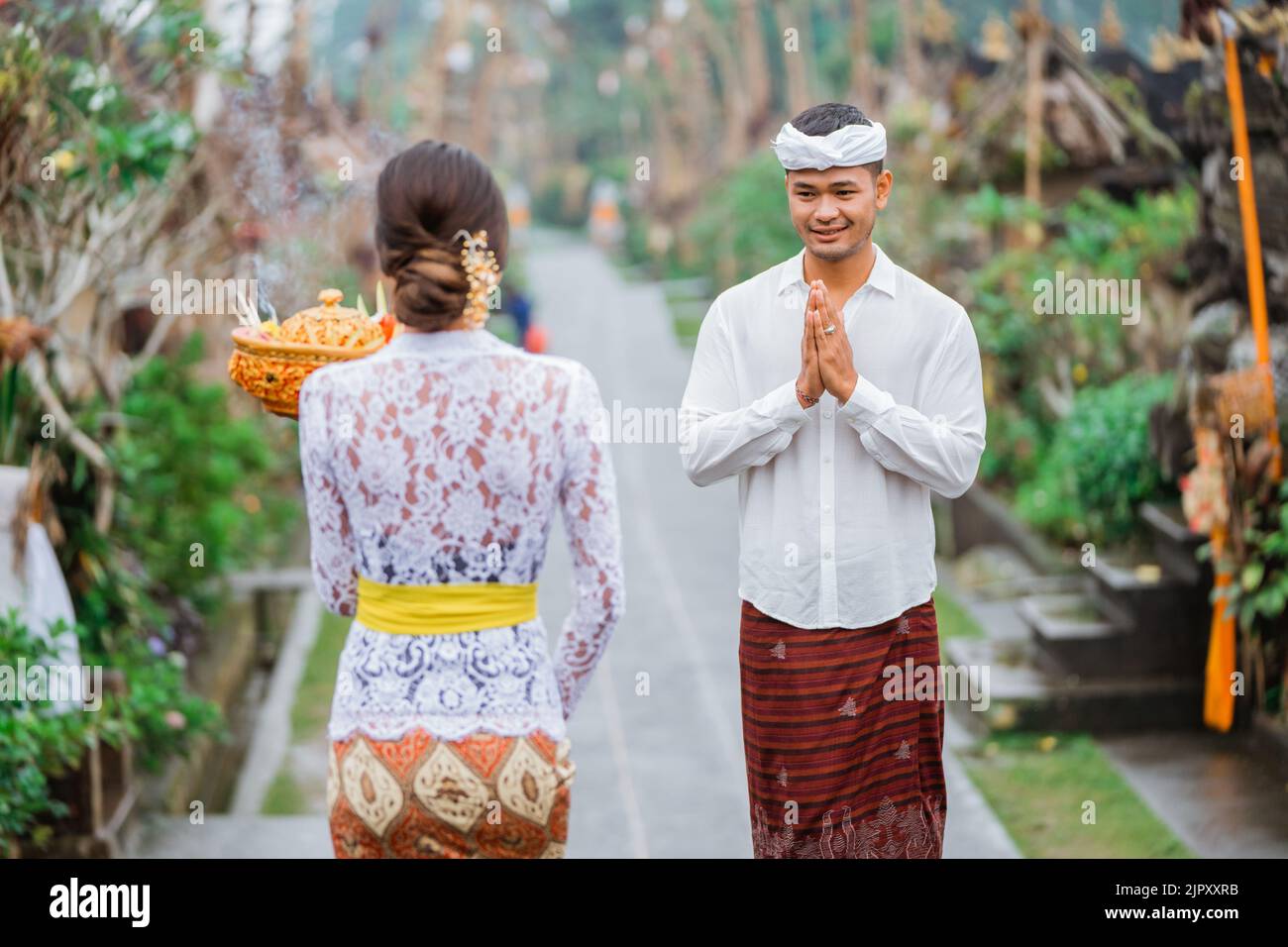 balinese people wearing traditional clothing in penglipuran village