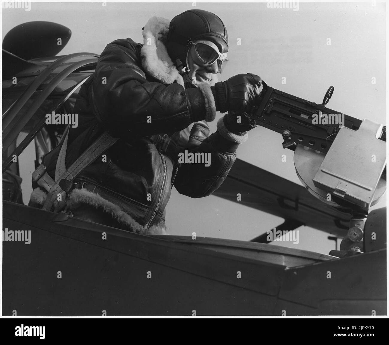 This crack aerial machine gunner is part of an unbeatable combination. He has a fast, accurate gun-and the world's... Stock Photo