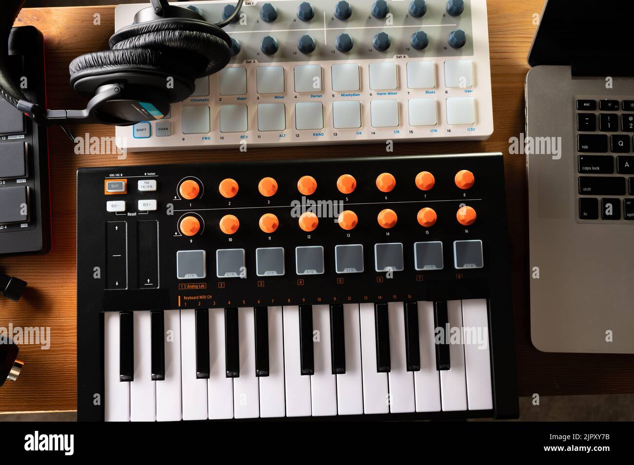 MIDI keyboard and studio headphones. Recording studio, work with sound