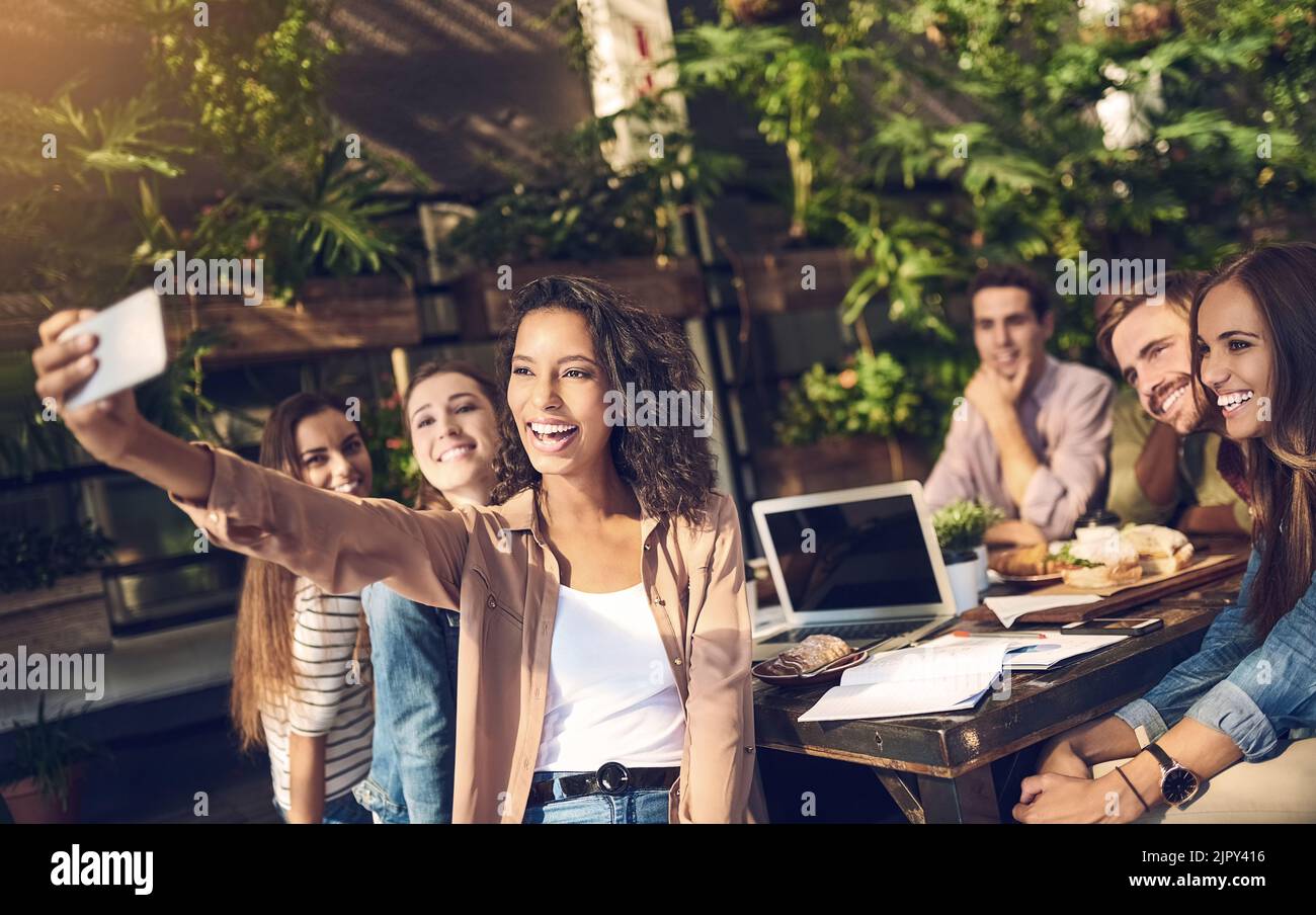 Selfie for having another successful meeting. creative employees taking a selfie outdoors. Stock Photo