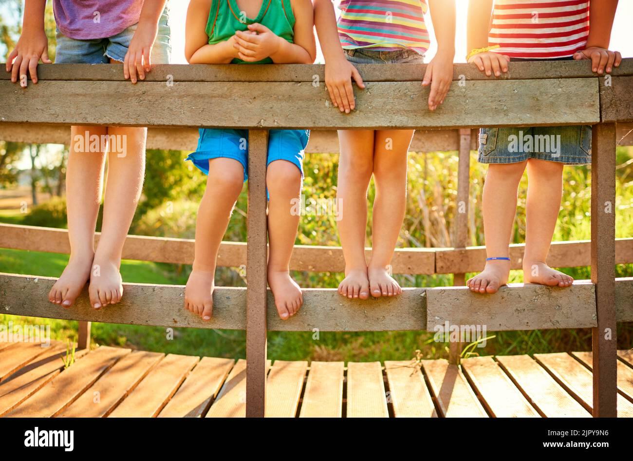 These feet are ready to jump into a day of fun. little kids playing outdoors. Stock Photo