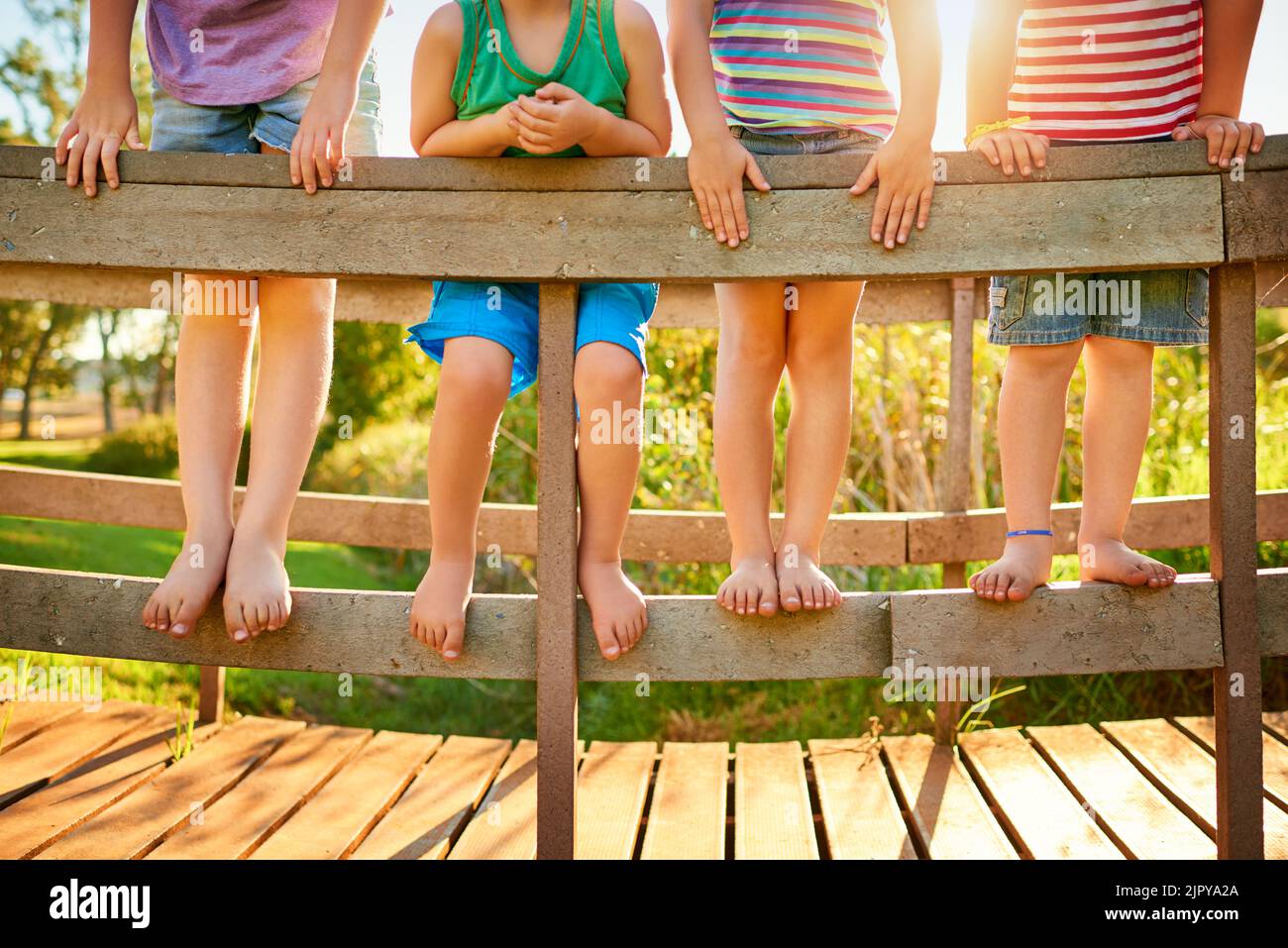 The innocence and fun of childhood. little kids playing outdoors. Stock Photo