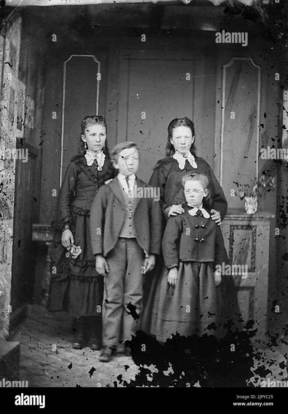Three girls and a boy Stock Photo - Alamy
