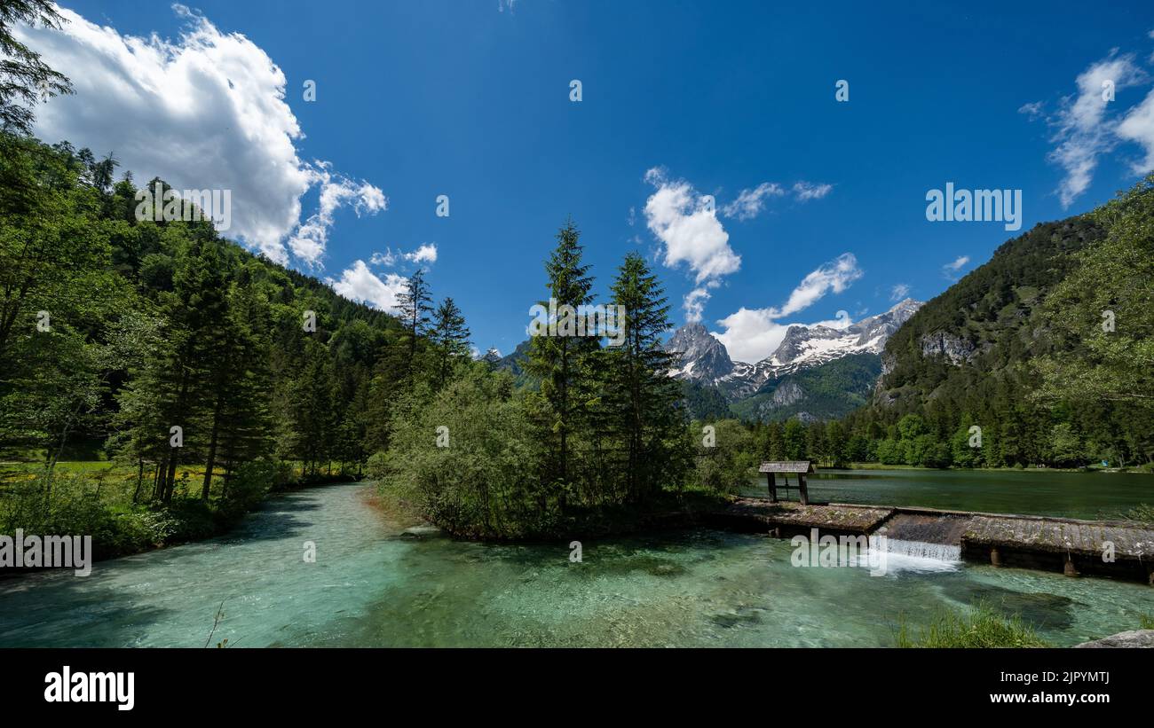 Scenic lake Schiederweiher, deciduous green woods and majestic mountains in Hinterstoder, Austria Stock Photo