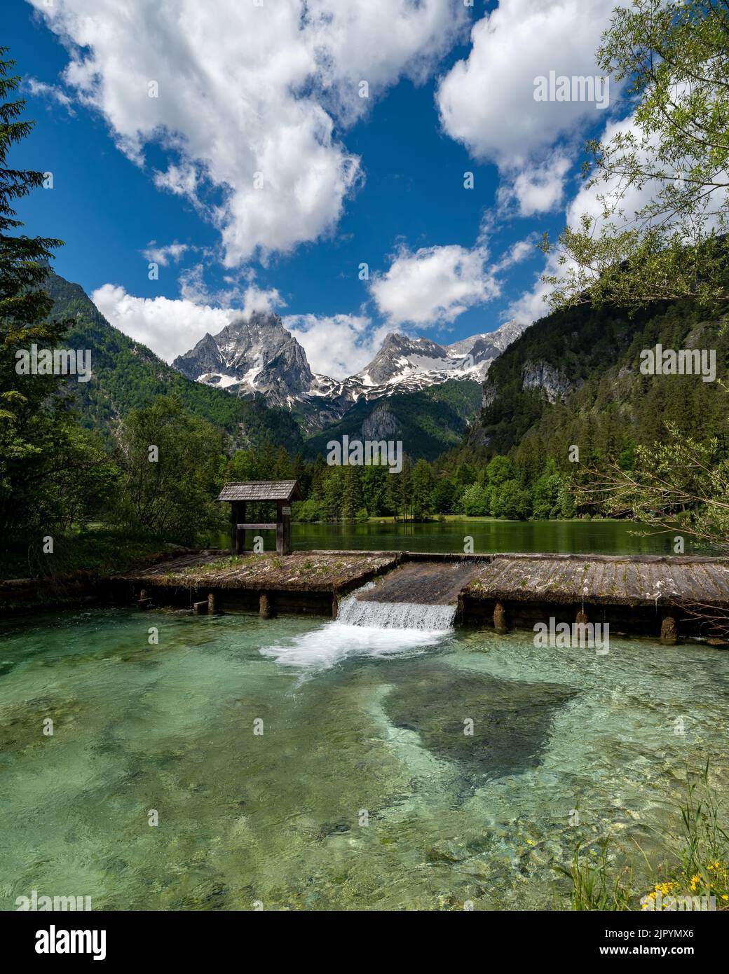 A vertical shot of dam on scenic lake Schiederweiher in Hinterstoder, Austria Stock Photo