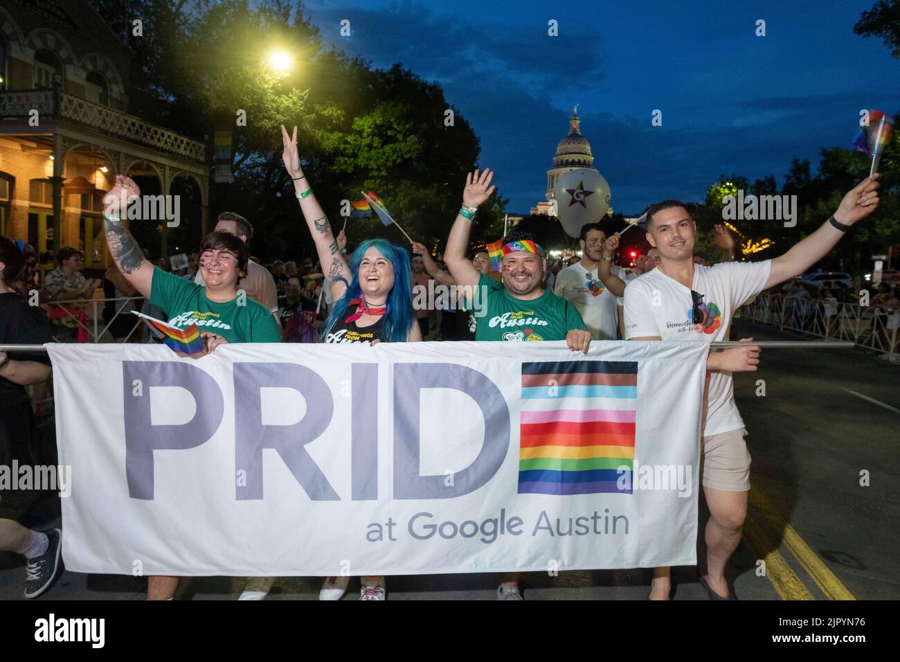 Google employees of Austin show off their pride as they parade down