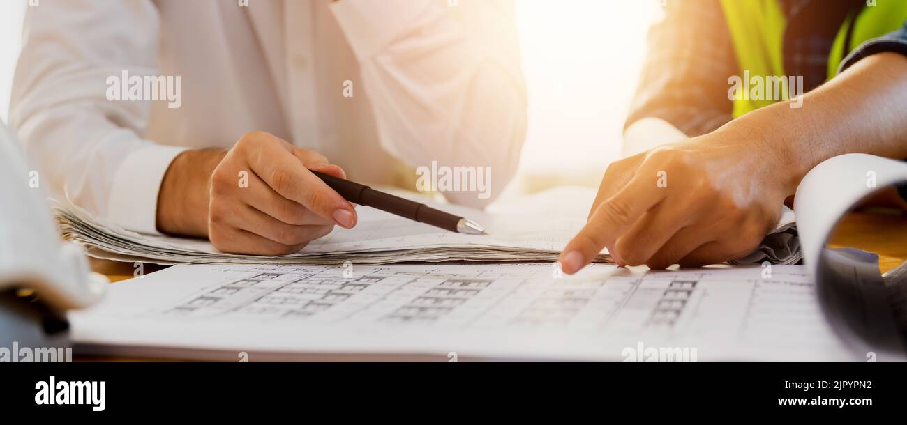 Teamwork cooperate and brainstorming concept, legal and engineer advisor, two worker people talking, planning analyze building construction Stock Photo