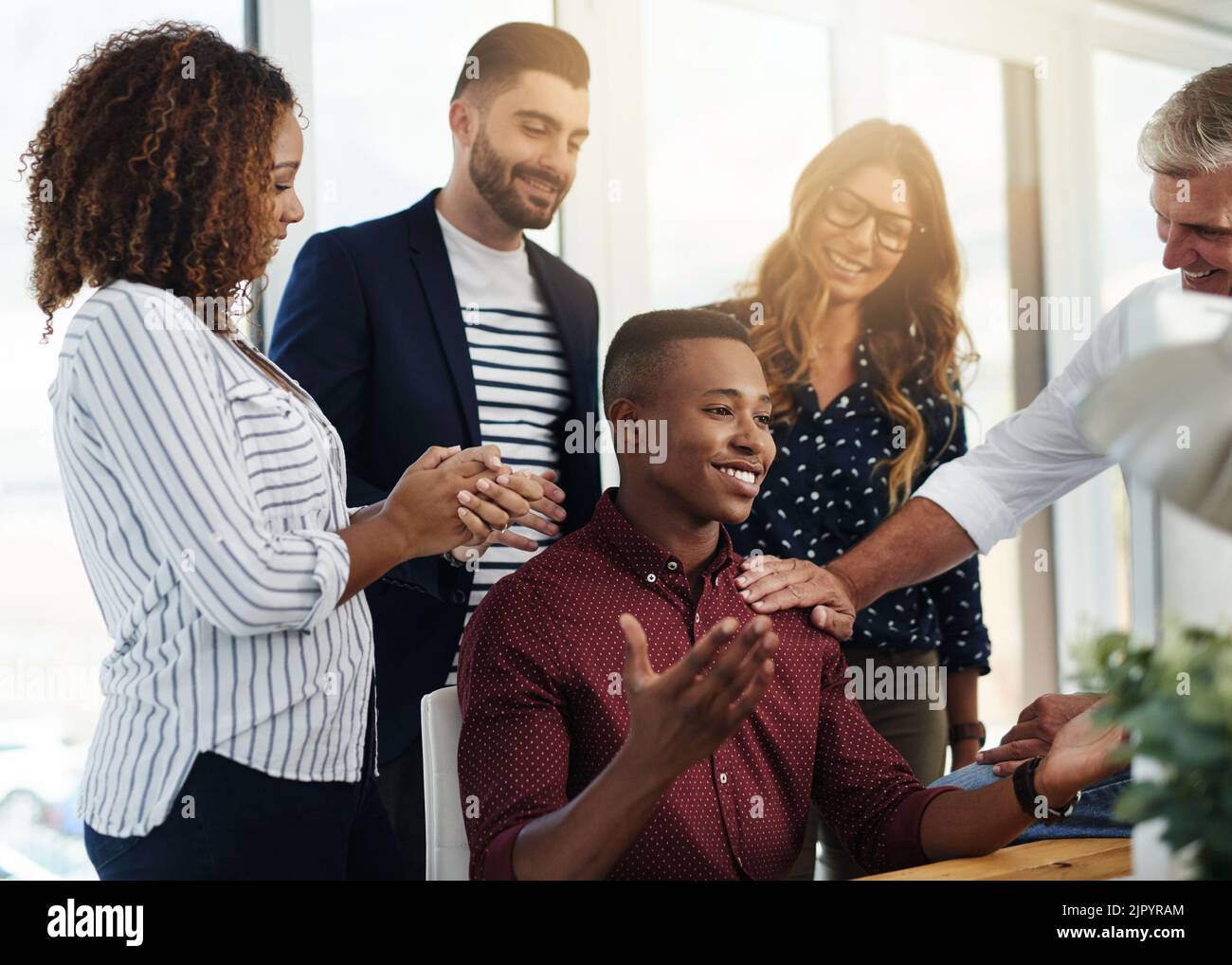 They can always depend on him. a group of designers working together. Stock Photo